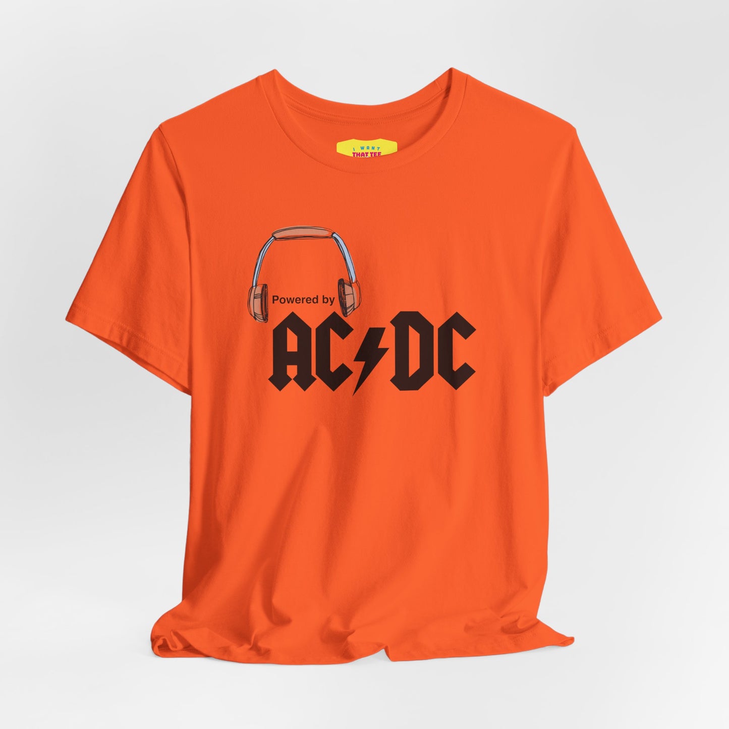 POWERED BY AC/DC (Black text, Unisex Softstyle T-Shirt)